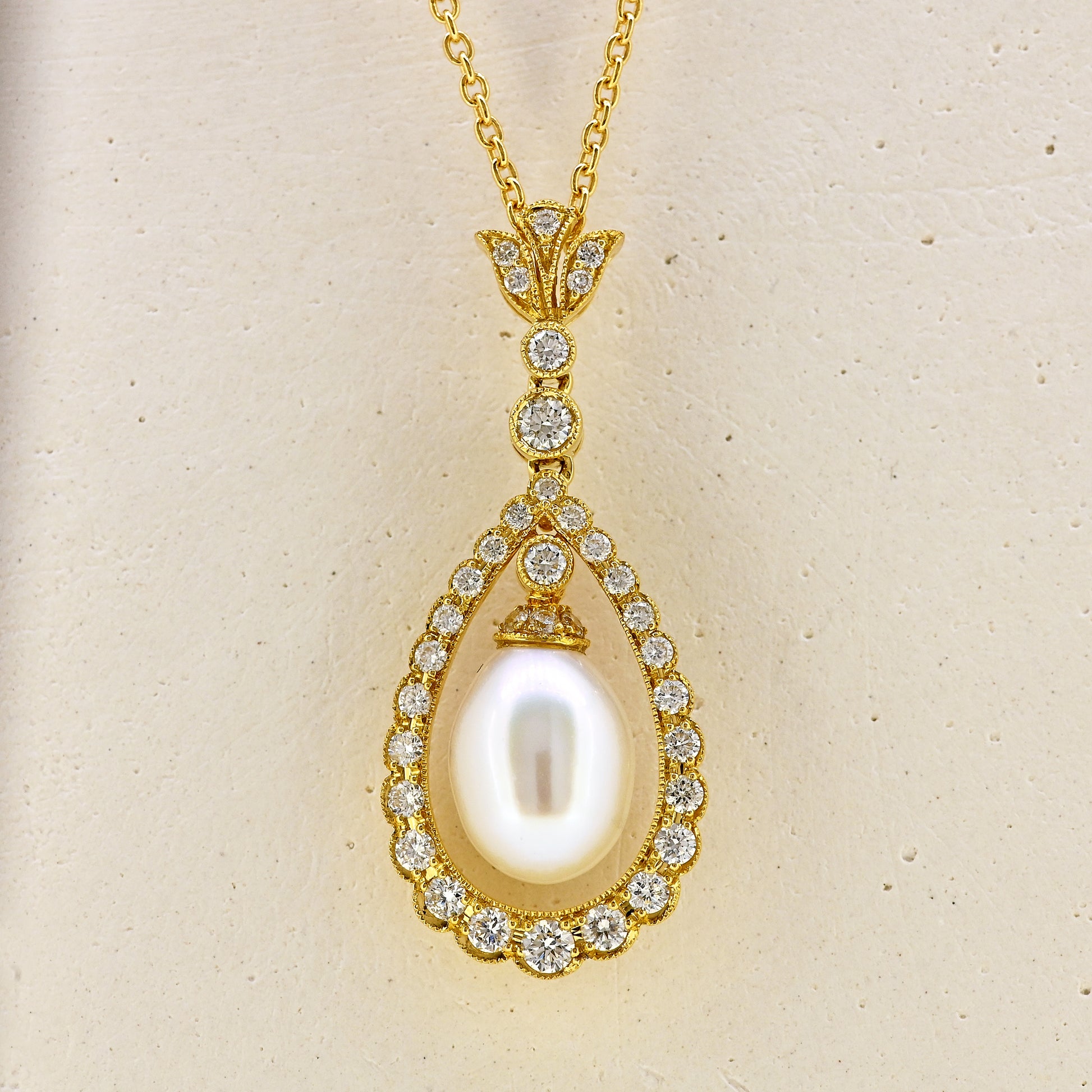 Pearl necklace, diamond and pearl necklace, pearl and diamond necklace, free hanging pearl, hanging pearl, free hanging pearl necklace, 18ct pearl necklace, 18ct pearl and diamond necklace