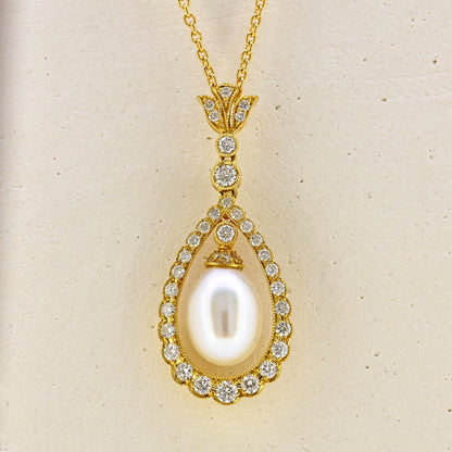 Pearl necklace, diamond and pearl necklace, pearl and diamond necklace, free hanging pearl, hanging pearl, free hanging pearl necklace, 18ct pearl necklace, 18ct pearl and diamond necklace