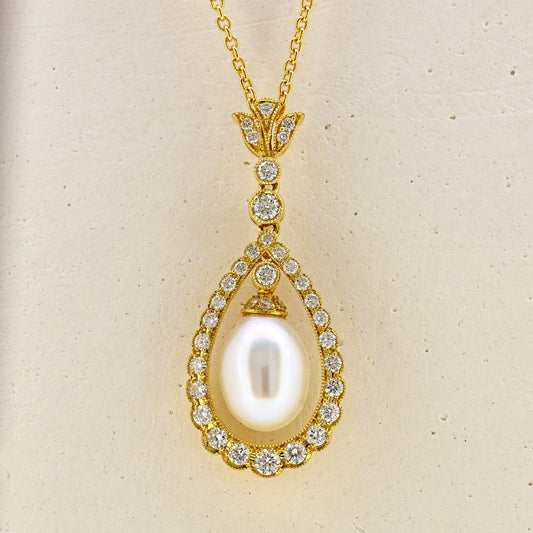 Pearl necklace, diamond and pearl necklace, pearl and diamond necklace, free hanging pearl, hanging pearl, free hanging pearl necklace, 18ct pearl necklace, 18ct pearl and diamond necklace