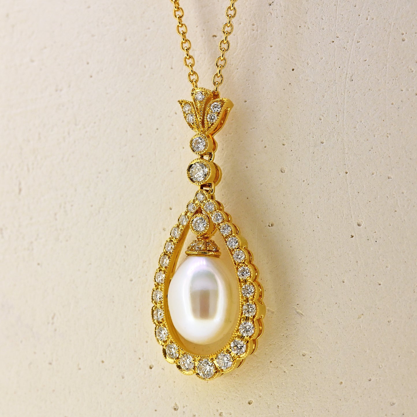 Pearl necklace, diamond and pearl necklace, pearl and diamond necklace, free hanging pearl, hanging pearl, free hanging pearl necklace, 18ct pearl necklace, 18ct pearl and diamond necklace