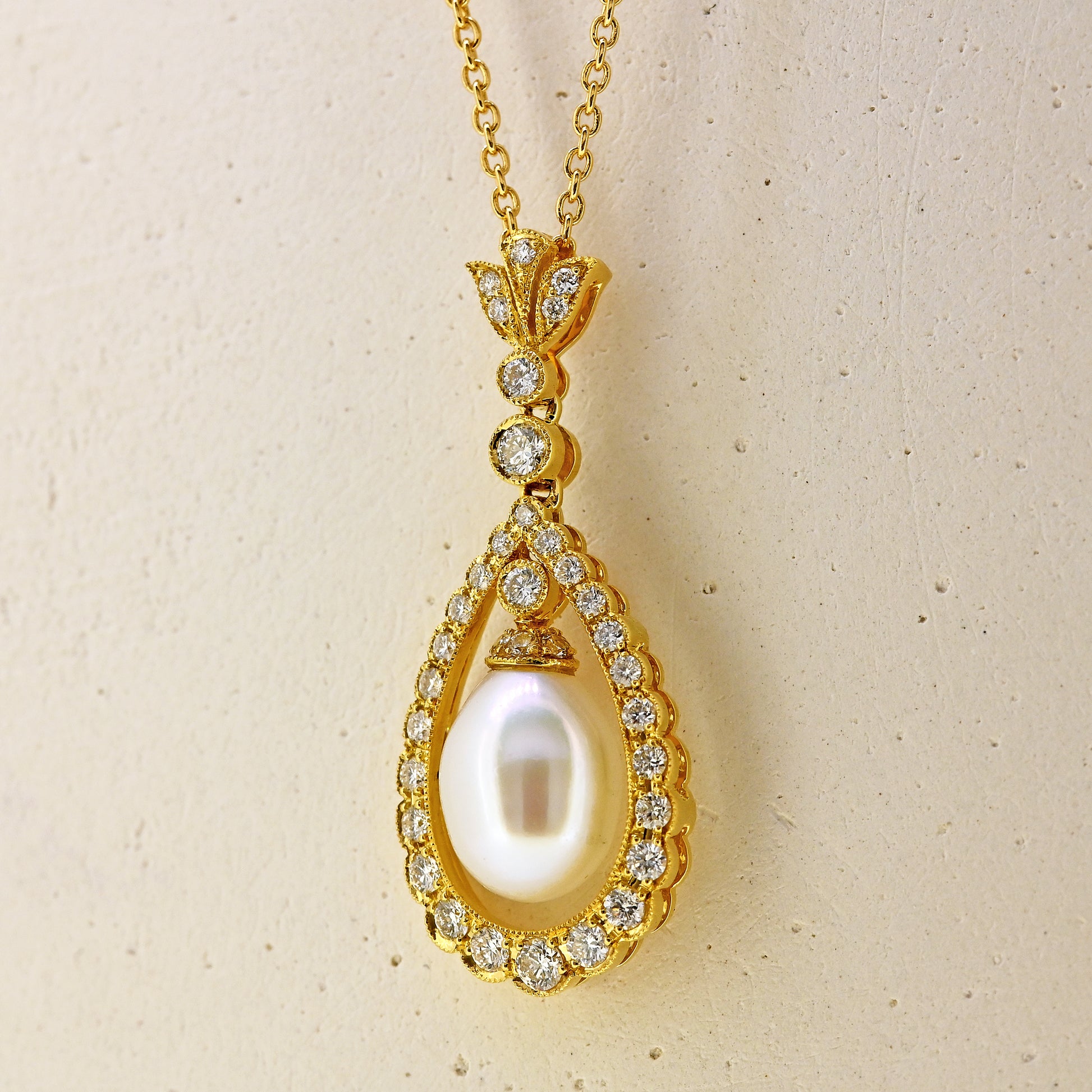 Pearl necklace, diamond and pearl necklace, pearl and diamond necklace, free hanging pearl, hanging pearl, free hanging pearl necklace, 18ct pearl necklace, 18ct pearl and diamond necklace