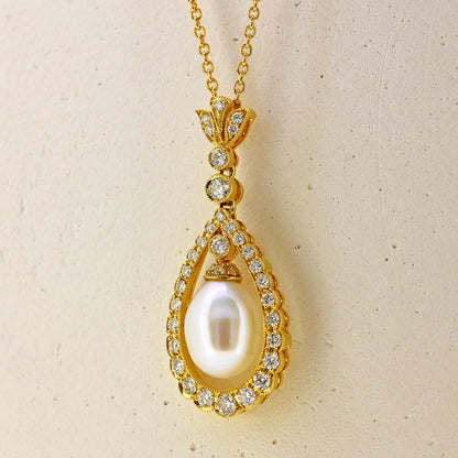 Pearl necklace, diamond and pearl necklace, pearl and diamond necklace, free hanging pearl, hanging pearl, free hanging pearl necklace, 18ct pearl necklace, 18ct pearl and diamond necklace