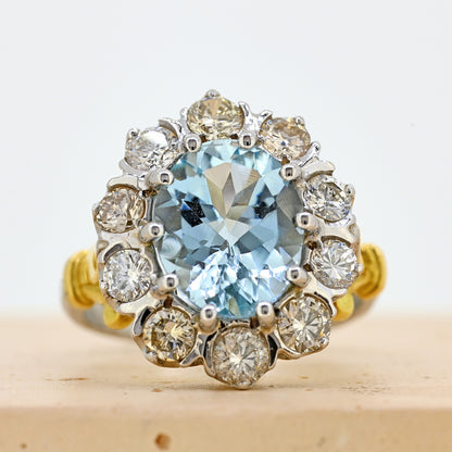aquamarine and diamond ring, aqua and diamond ring, two colour gold aquamarine ring, aquamarine diamond cluster ring, white gold aquamarine ring, white gold aquamarine and diamond cluster ring