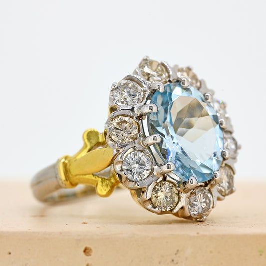 aquamarine and diamond ring, aqua and diamond ring, two colour gold aquamarine ring, aquamarine diamond cluster ring, white gold aquamarine ring, white gold aquamarine and diamond cluster ring