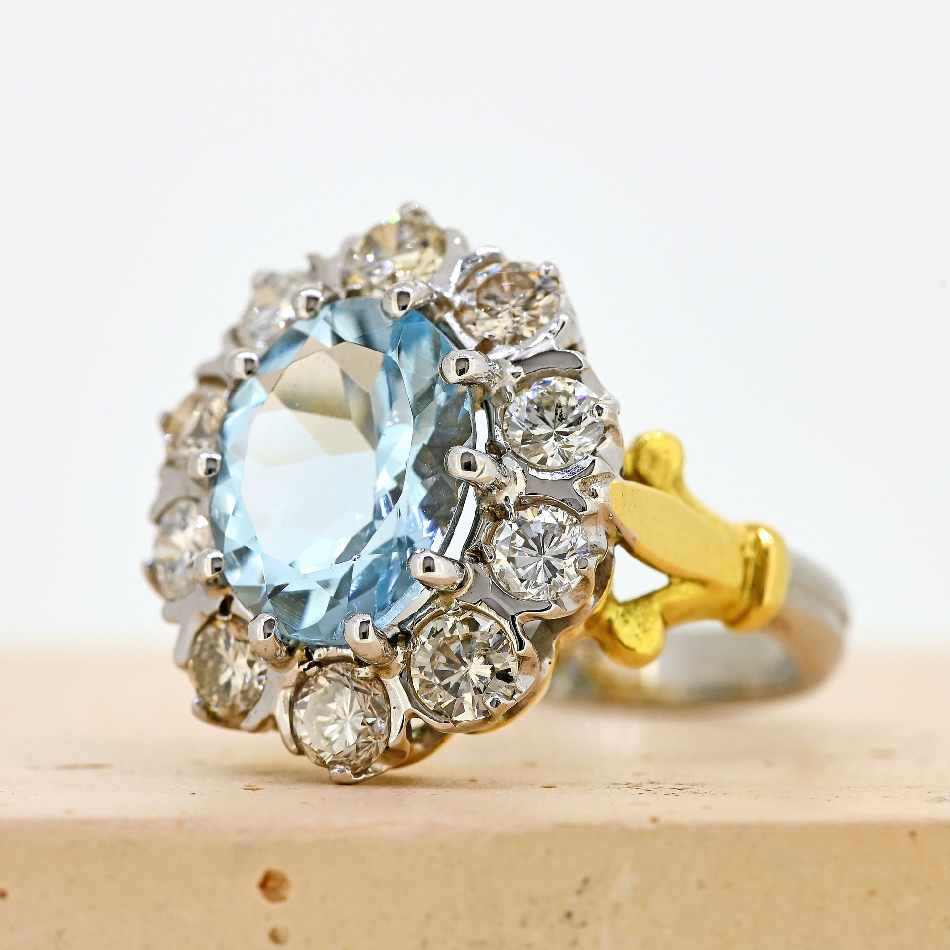 aquamarine and diamond ring, aqua and diamond ring, two colour gold aquamarine ring, aquamarine diamond cluster ring, white gold aquamarine ring, white gold aquamarine and diamond cluster ring