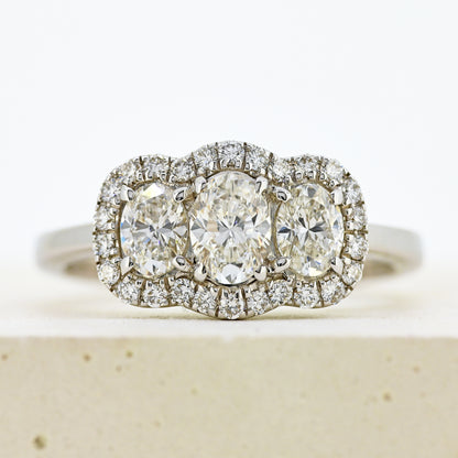 diamond three stonr, 18ct diamond three stone, diamond three stone cluster, oval diamond three stone, 18ct oval three stone with diamond surround