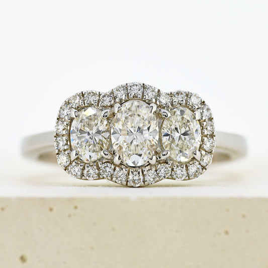 diamond three stonr, 18ct diamond three stone, diamond three stone cluster, oval diamond three stone, 18ct oval three stone with diamond surround