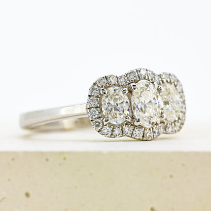diamond three stonr, 18ct diamond three stone, diamond three stone cluster, oval diamond three stone, 18ct oval three stone with diamond surround