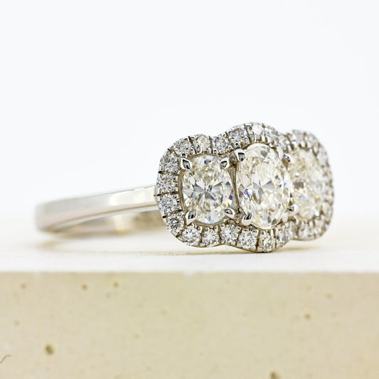diamond three stonr, 18ct diamond three stone, diamond three stone cluster, oval diamond three stone, 18ct oval three stone with diamond surround