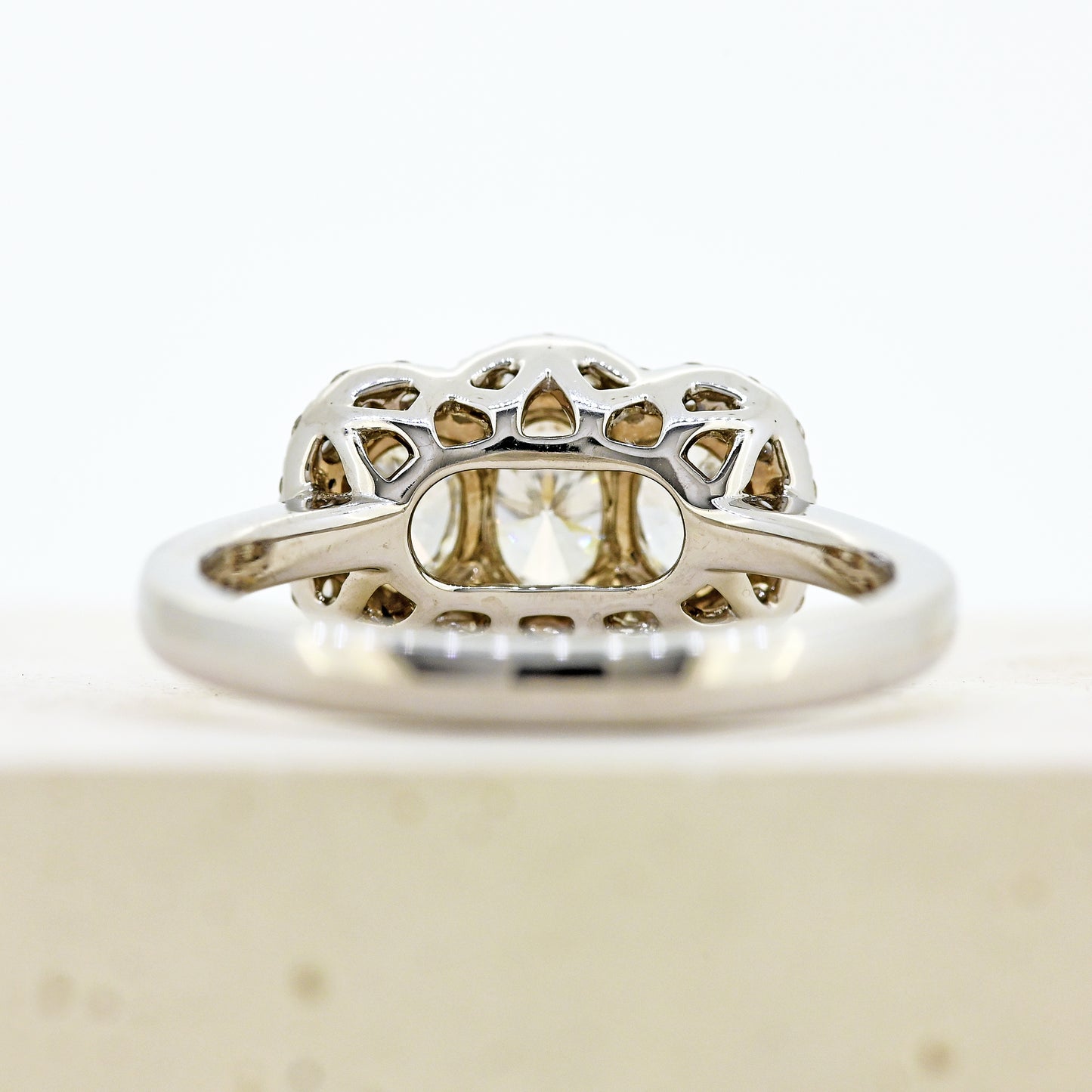 diamond three stonr, 18ct diamond three stone, diamond three stone cluster, oval diamond three stone, 18ct oval three stone with diamond surround