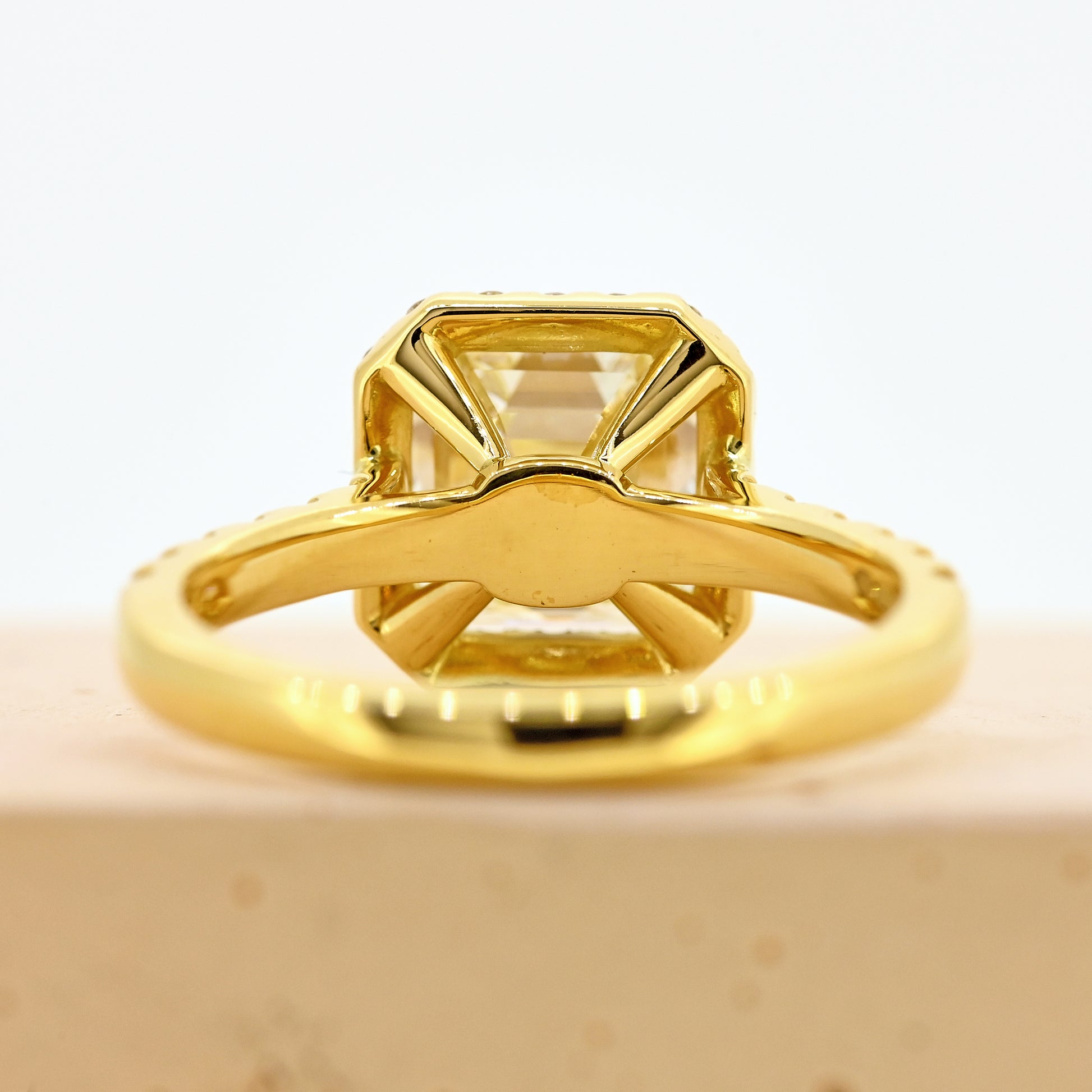 18ct asscher cut diamond ring, asscher diamond ring, asscher halo ring, asscher cut diamond ring with diamond shoulders, 18ct asscher halo ring with shoulder diamonds, 18ct yellow gold asscher cut diamond ring